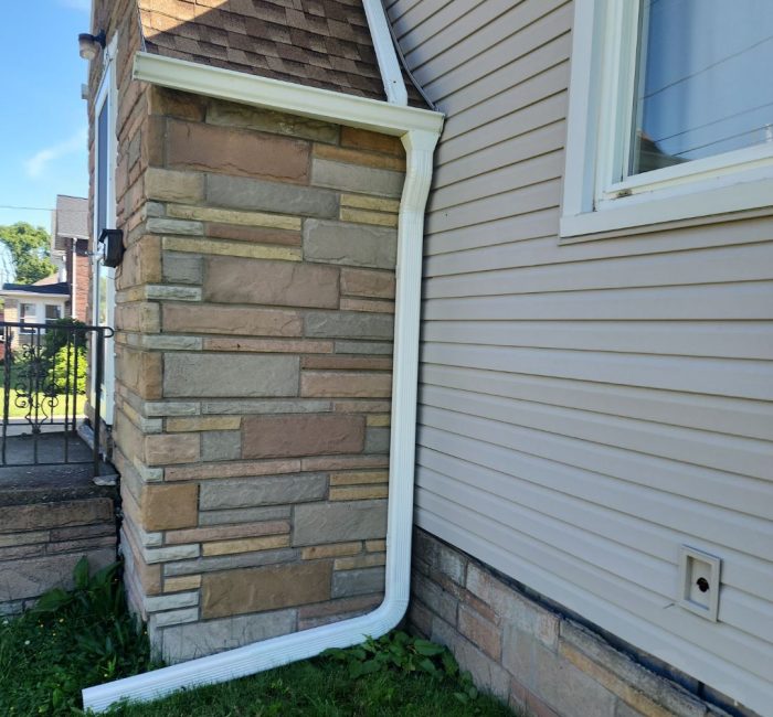 White gutter with house installed by Gutter Solutions of Lake Erie