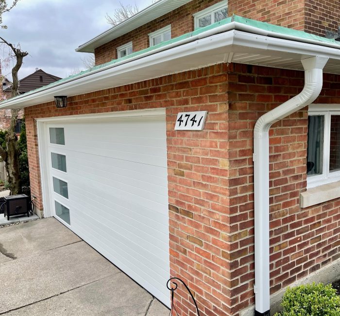 White gutter on brick house