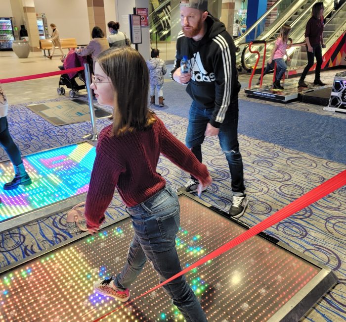 Bauer employees at the arcade dancing
