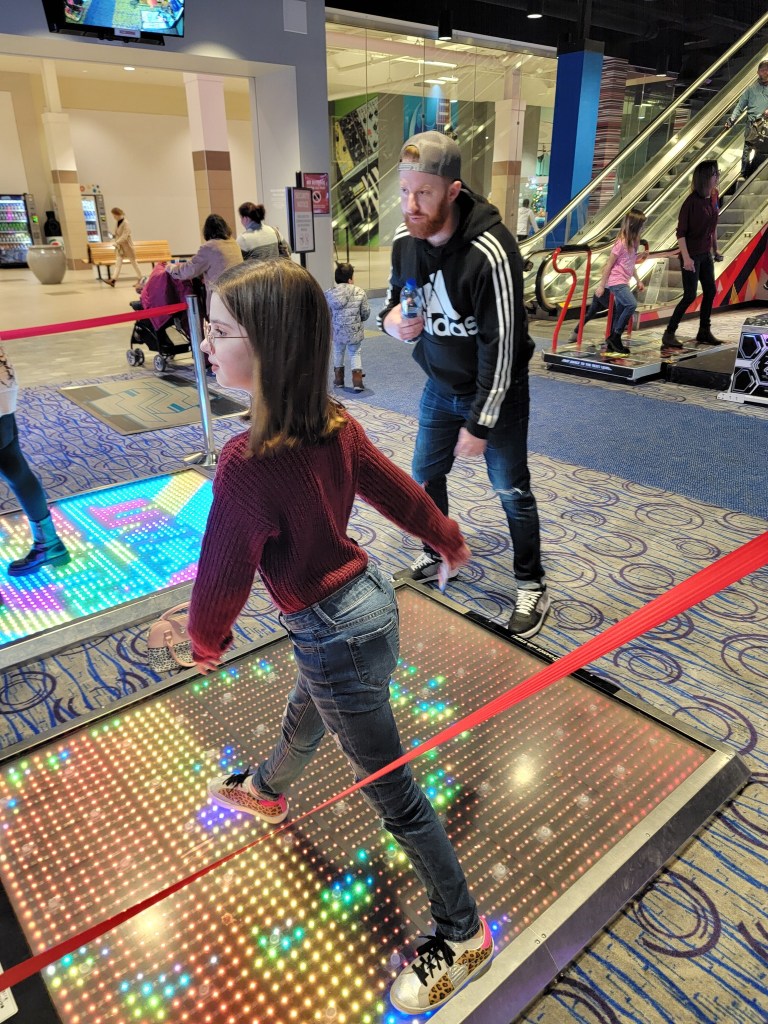 Bauer employees at the arcade dancing