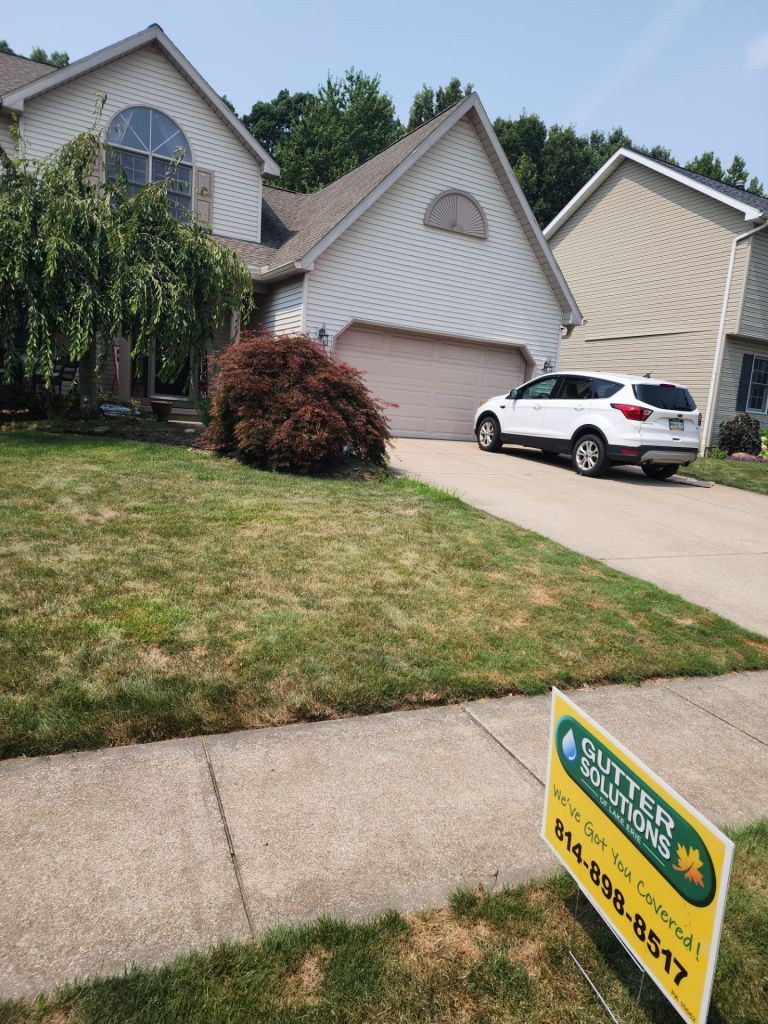 Gutter Solutions of Lake Erie yard sign in front of house. 