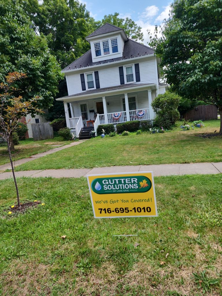 Gutter Solutions of Lake Erie yard sign in front of house.