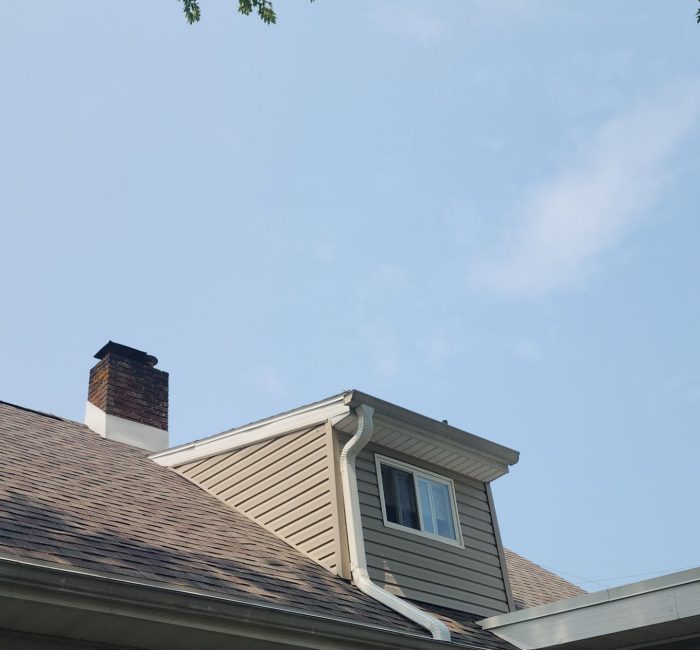 Gutter on top of second floor dormer installed by Gutter Solutions of Lake Erie