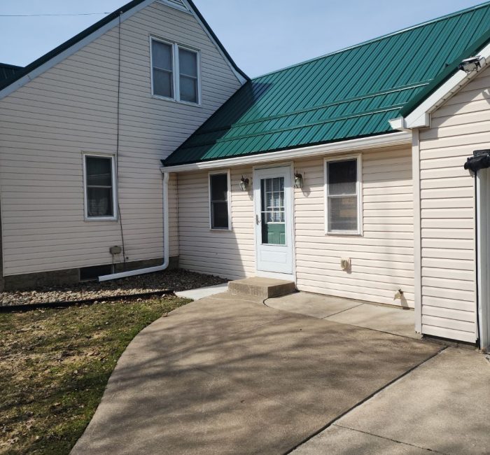 Gutter installed on house with green roof installed by Gutter Solutions of Lake Erie